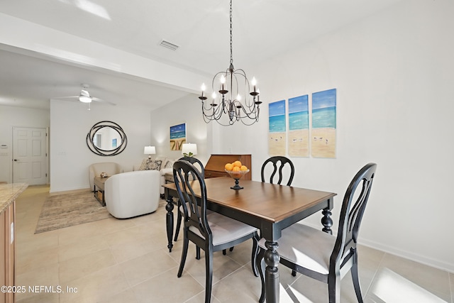 dining room with light tile patterned floors, ceiling fan, visible vents, and baseboards