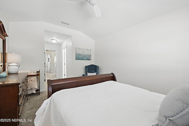 carpeted bedroom with a ceiling fan, visible vents, and vaulted ceiling