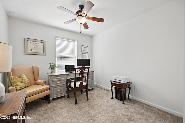 office with light colored carpet, ceiling fan, and baseboards