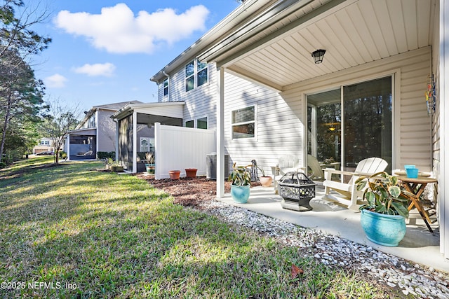 view of yard with an outdoor fire pit, cooling unit, and a patio