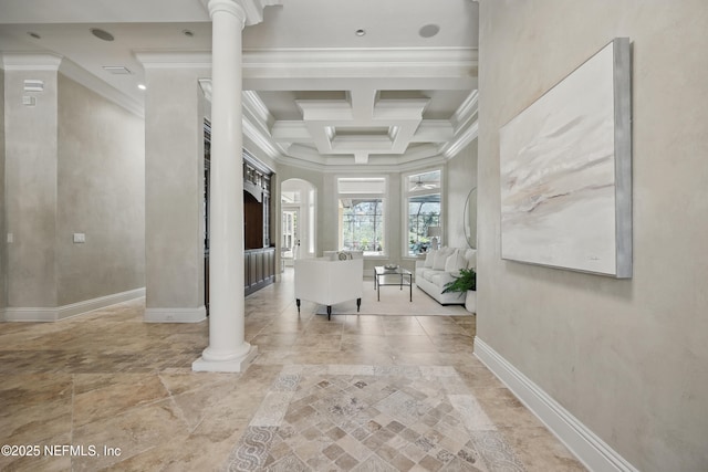 interior space featuring baseboards, coffered ceiling, ornamental molding, ornate columns, and beam ceiling