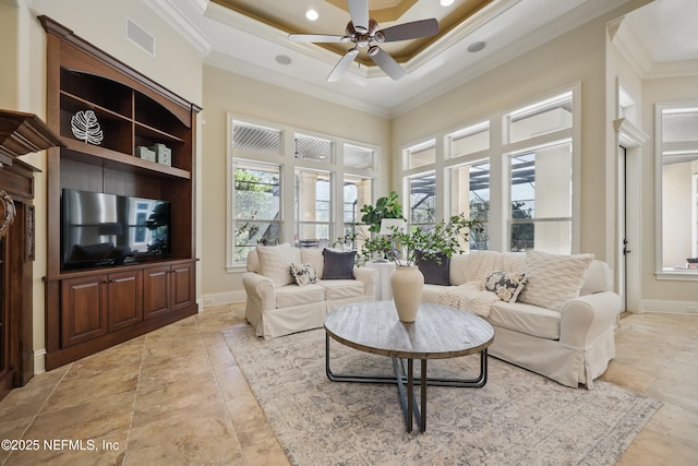 interior space featuring crown molding, visible vents, a towering ceiling, ceiling fan, and baseboards