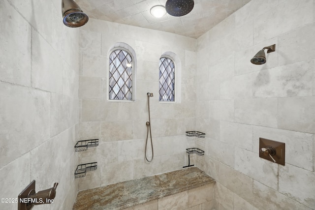 full bath with a tile shower