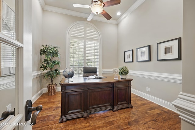 home office with dark wood-style floors, baseboards, ornamental molding, and a ceiling fan