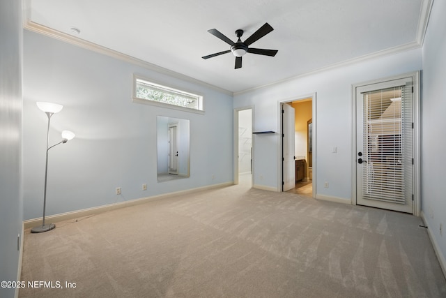 unfurnished bedroom featuring ornamental molding, carpet, ensuite bath, and baseboards