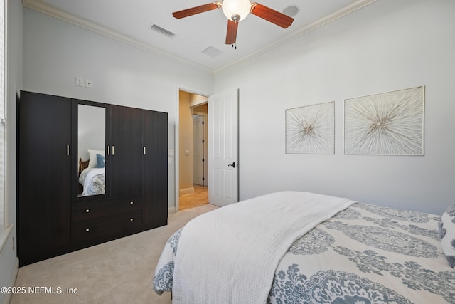 carpeted bedroom with visible vents, crown molding, and ceiling fan