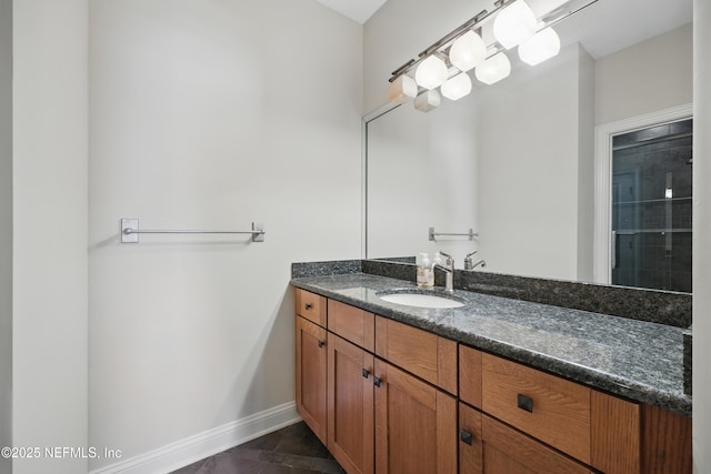 bathroom featuring vanity and baseboards