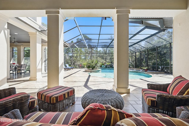 view of patio / terrace with ceiling fan, glass enclosure, a pool with connected hot tub, and an outdoor living space