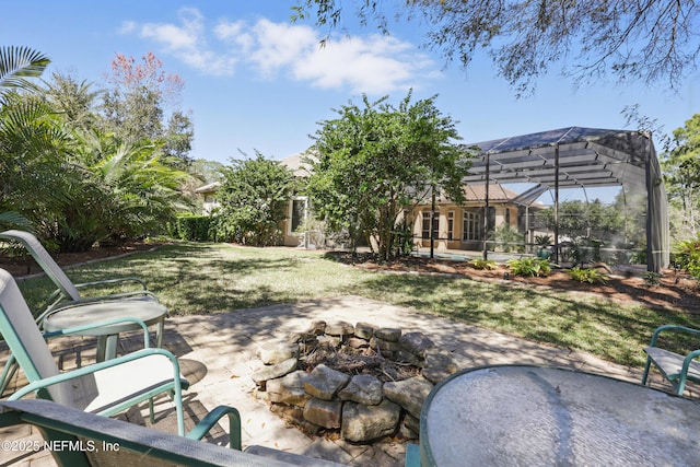 view of patio with a fire pit and glass enclosure