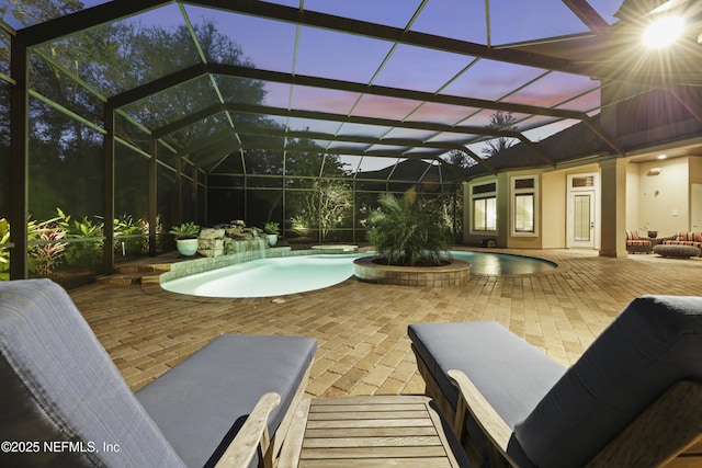 outdoor pool with a lanai and a patio area