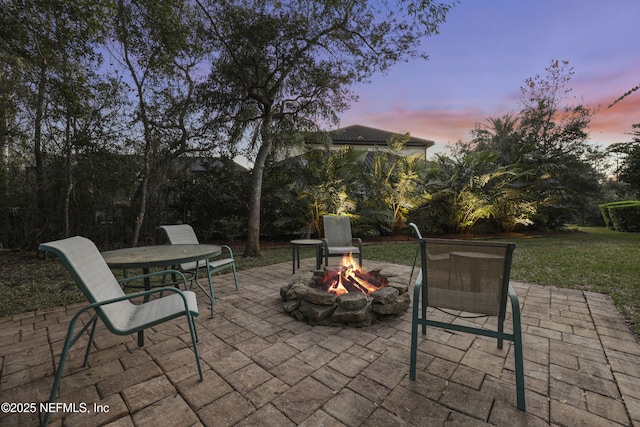 view of patio with a fire pit and outdoor dining space