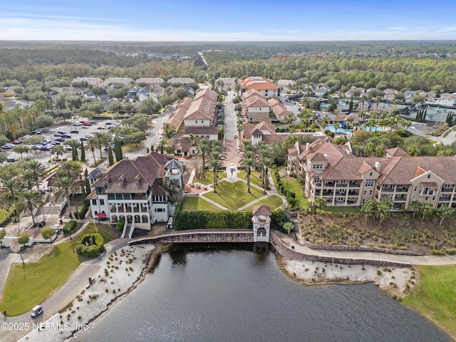 bird's eye view featuring a water view and a residential view