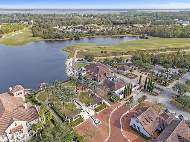 aerial view with a residential view, view of golf course, and a water view