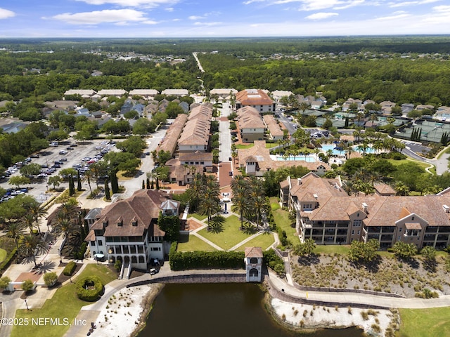 birds eye view of property featuring a residential view and a water view