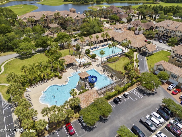 bird's eye view with a water view and a residential view