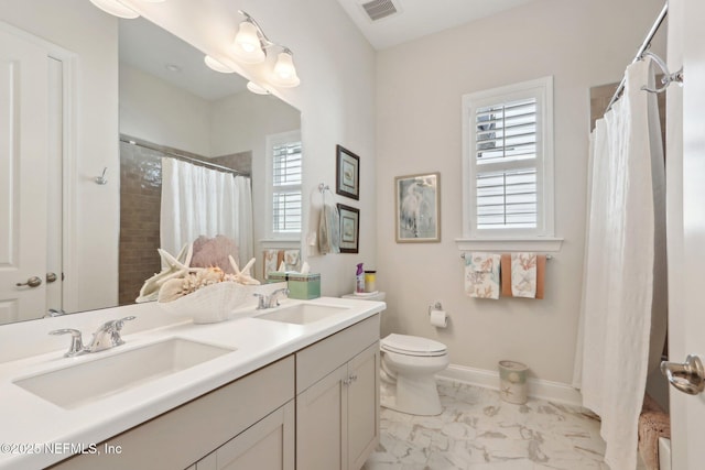 full bathroom with marble finish floor, visible vents, a sink, and baseboards