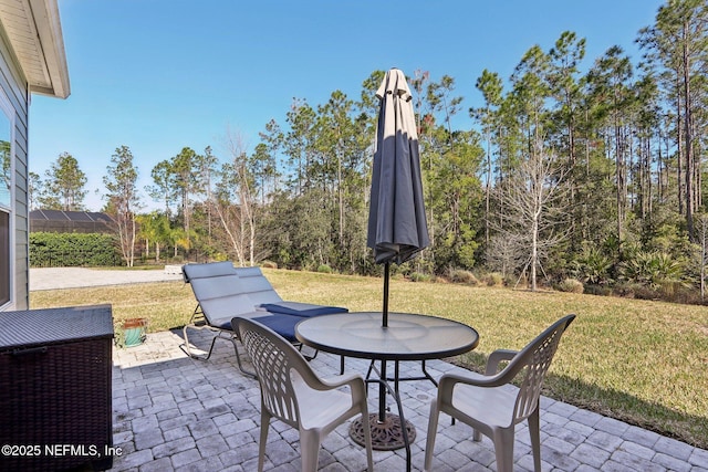 view of patio featuring outdoor dining area