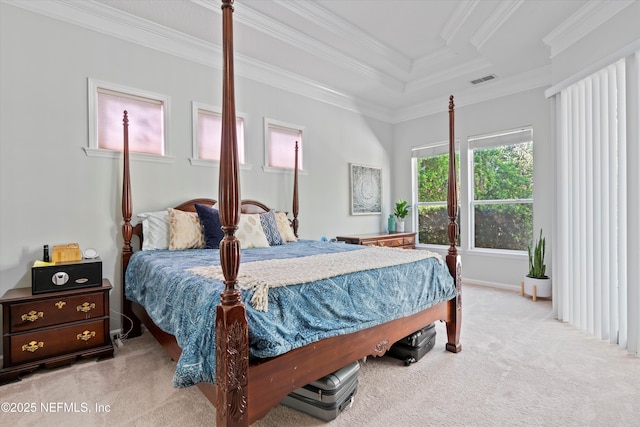 carpeted bedroom featuring ornamental molding and visible vents