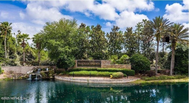 community sign with a water view