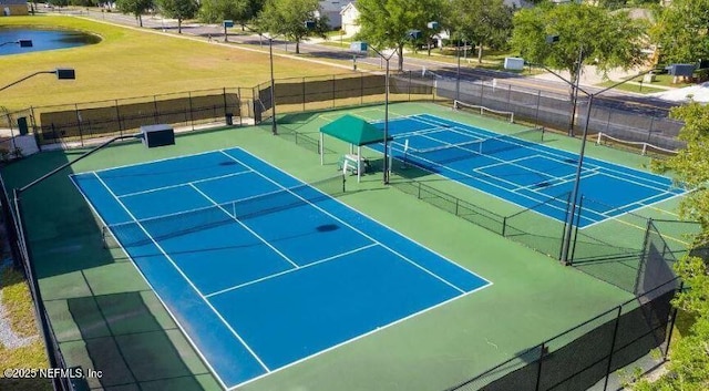 view of tennis court with fence