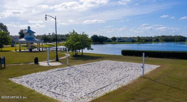 view of home's community with volleyball court, a water view, a yard, and a gazebo