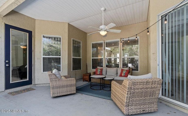 view of patio featuring ceiling fan and an outdoor living space