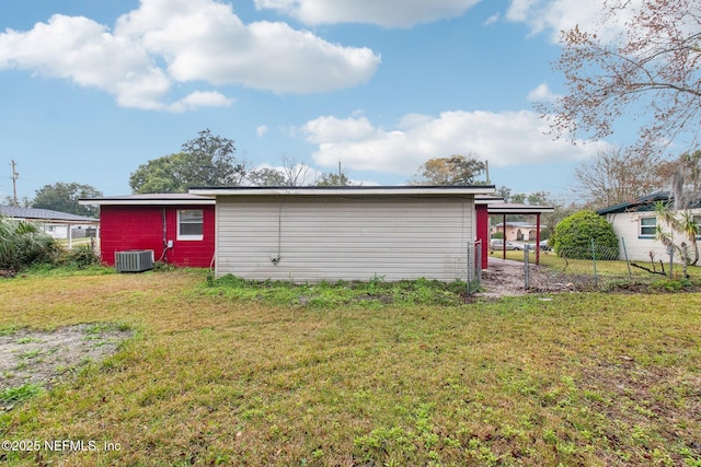 view of outdoor structure featuring a carport and cooling unit