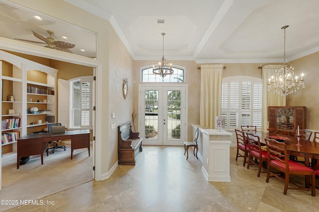 foyer with ornamental molding, a wealth of natural light, and french doors