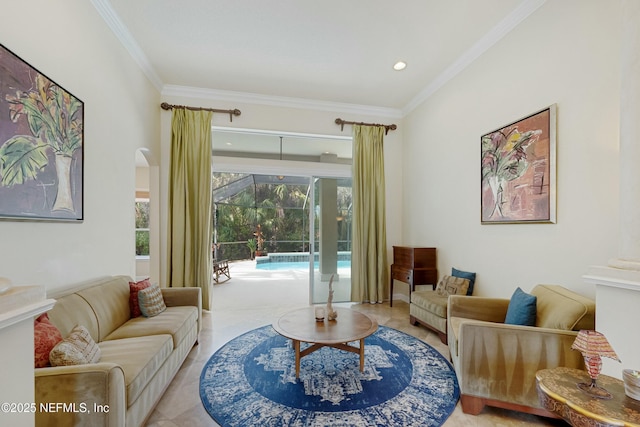 living area featuring a sunroom, crown molding, and tile patterned floors