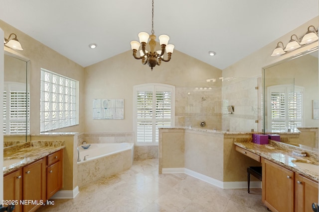 bathroom with a garden tub, vaulted ceiling, vanity, a chandelier, and a walk in shower