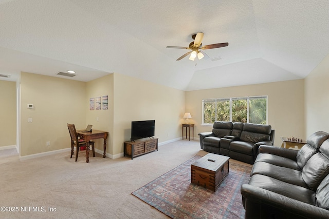 living room featuring a ceiling fan, light carpet, vaulted ceiling, a textured ceiling, and baseboards