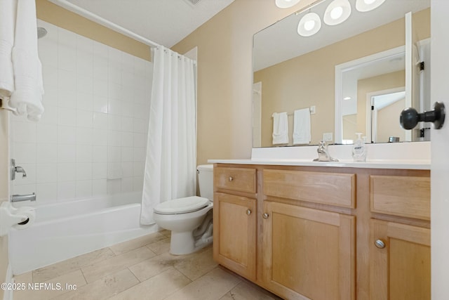 bathroom with shower / bath combo, vanity, and toilet