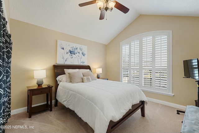 bedroom featuring vaulted ceiling, carpet, a ceiling fan, and baseboards