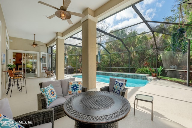 view of patio / terrace with an outdoor pool, glass enclosure, an outdoor hangout area, and a ceiling fan