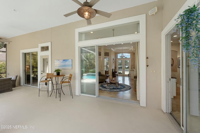 view of patio with french doors and a ceiling fan