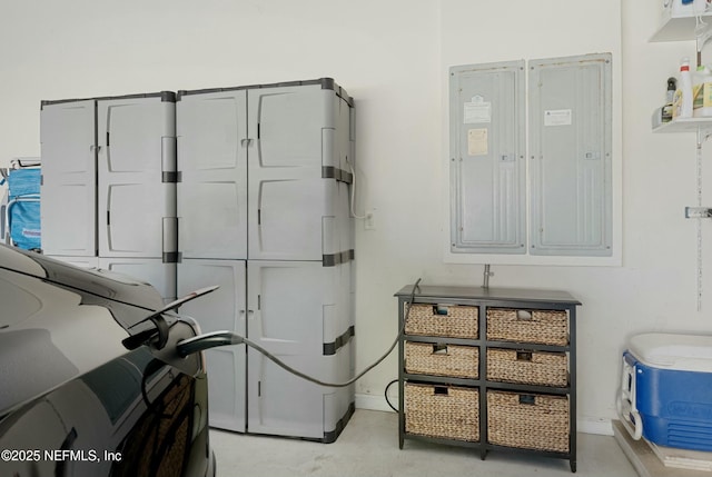 washroom featuring electric panel and baseboards