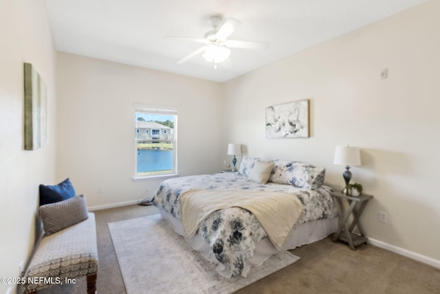 bedroom featuring carpet floors, baseboards, and a ceiling fan