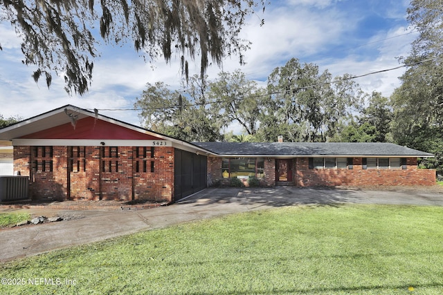 ranch-style home featuring an attached garage, central air condition unit, brick siding, concrete driveway, and a front yard