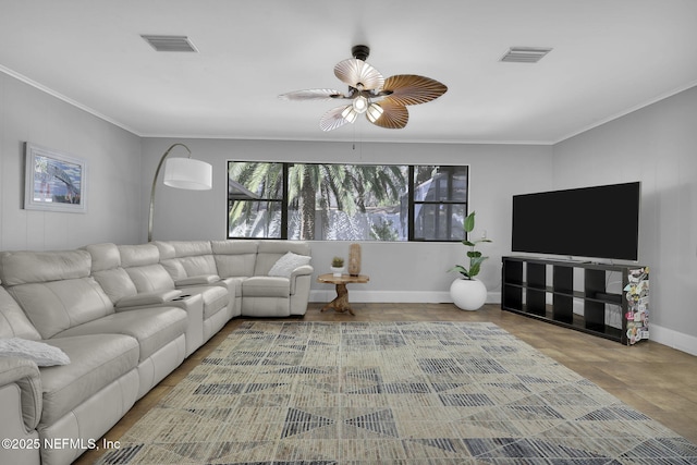 living room featuring ceiling fan, baseboards, visible vents, and crown molding