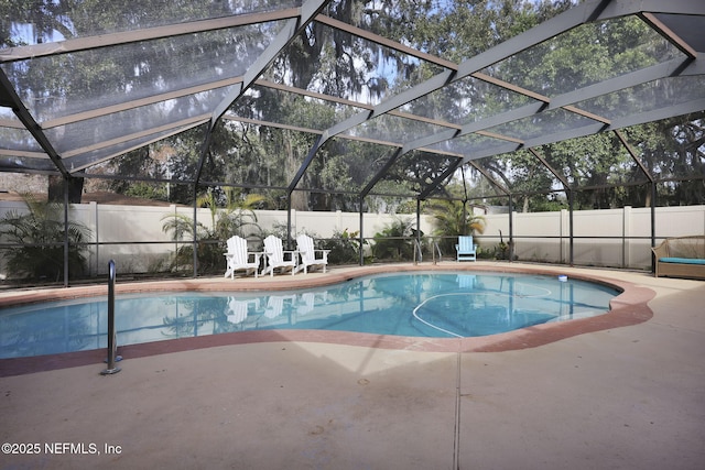 view of swimming pool featuring a fenced in pool, glass enclosure, a fenced backyard, and a patio