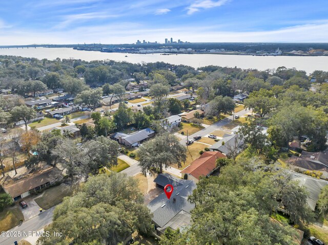 drone / aerial view with a water view and a residential view