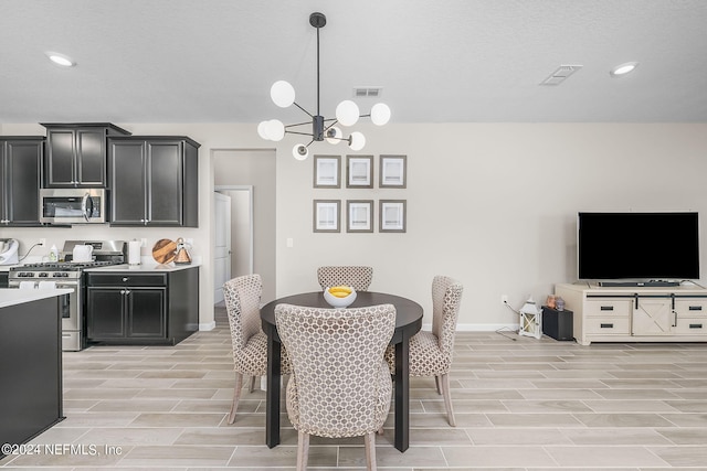 dining space featuring an inviting chandelier