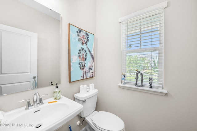 bathroom featuring toilet and sink