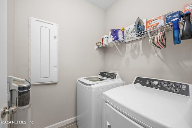 clothes washing area with washing machine and dryer