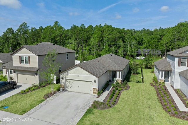 birds eye view of property with a view of trees