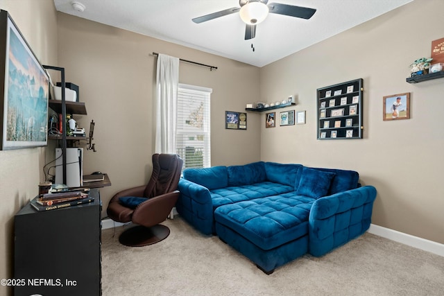 living room featuring carpet, a ceiling fan, and baseboards