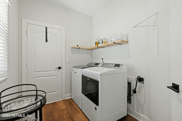 clothes washing area with laundry area, independent washer and dryer, and dark wood finished floors