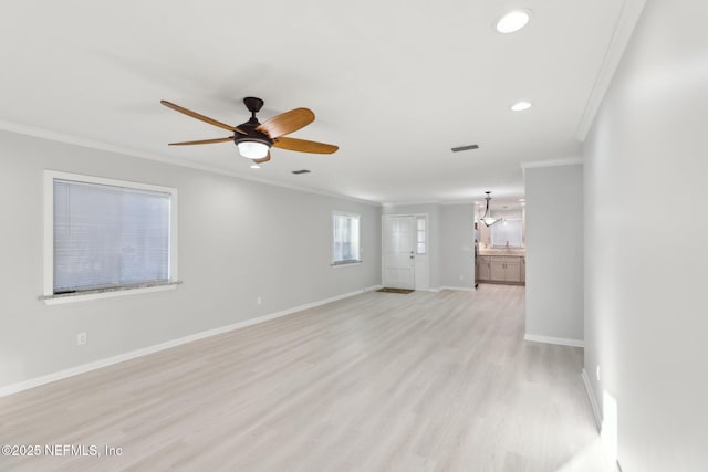 unfurnished room with recessed lighting, light wood-style flooring, ornamental molding, a ceiling fan, and baseboards