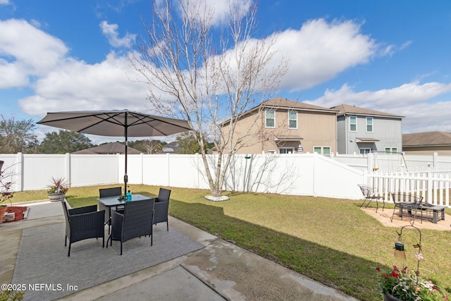 view of patio featuring outdoor dining area and a fenced backyard