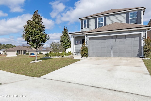 traditional-style house featuring a garage, concrete driveway, and a front lawn